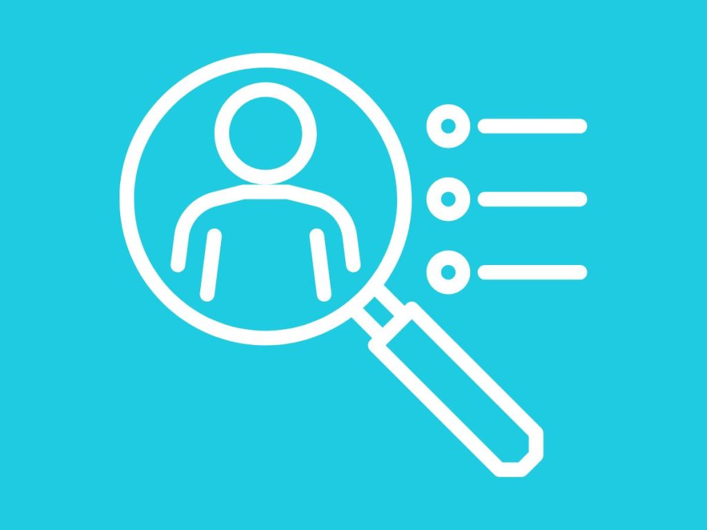 Magnifying glass over user profile for customer analysis.